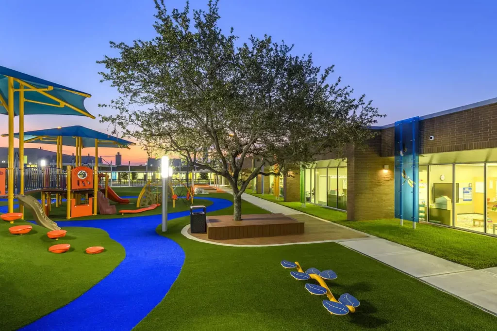 commercial playground on artificial grass lawn